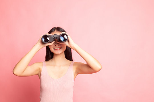 Young Asian Woman With Binoculars.