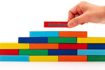 fill in business solutions concept, a piece of wooden block puzzle put on top of wooden stack