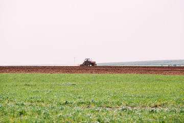 Tractor Plowing Field