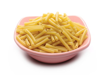 Macaroni, raw pasta in bowl isolated on white background