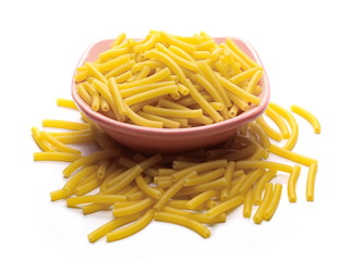 Macaroni, raw pasta in bowl isolated on white background