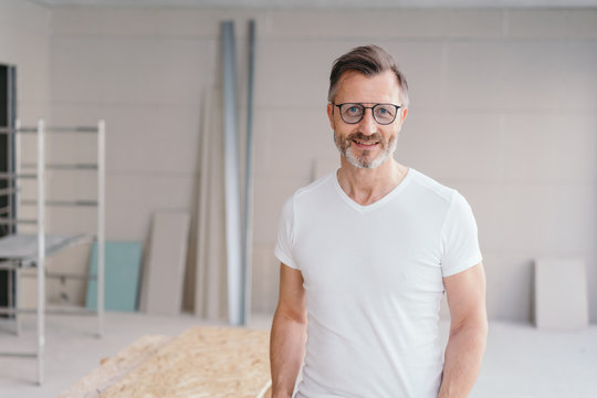 Relaxed friendly handyman wearing glasses