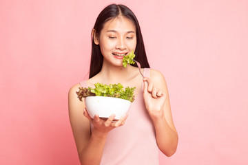 Healthy Asian woman with salad.