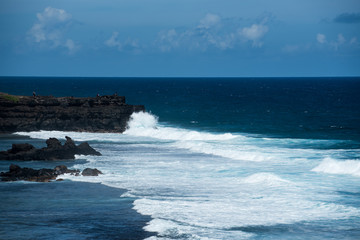 Powerful waves crashing island shore