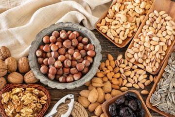 Full of nuts on the wooden rustic table.