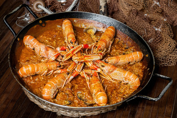 typical paella on a fishermen's table