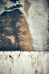 Old rusty stained metal board, toned abstract background or texture.