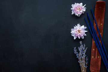 air freshener sticks with lavender and flowers on dark background top view mockup