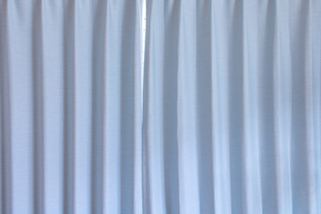 Fototapeta premium 水色のカーテンの背景