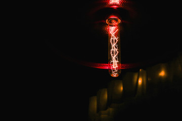 Electric incandescent lamp on a black background.