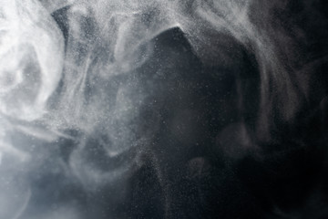 Abstract powder splatted background,Freeze motion of red powder exploding