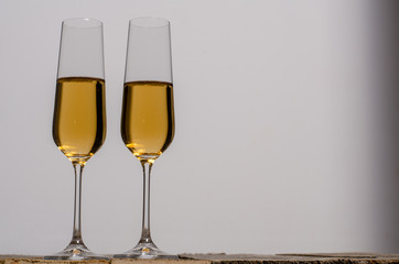 Top view of blank white dish and white tablecloth on a wood background with copy space