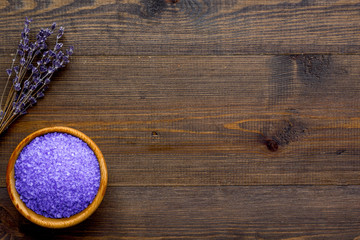purple spa salt for aroma therapy with lavender flower fragrance on wooden background top view copyspace
