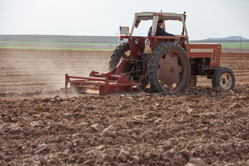 Tractor Plowing Field