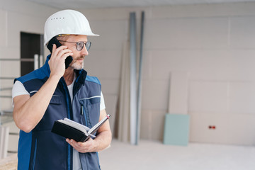 Builder talking on a mobile phone
