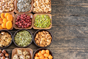Dried fruits on the rustic wooden table.