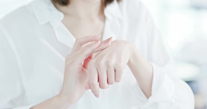 woman applying suncreen lotion