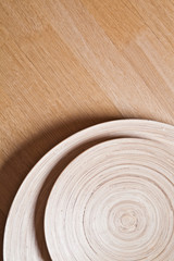 Bamboo bowls on wooden background.