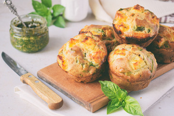 Freshly baked muffins with spinach, sweet potatoes and feta cheese on white background. Healthy food concept. Savory pastry.