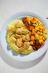 Chicken with rice and vegetable salad 
