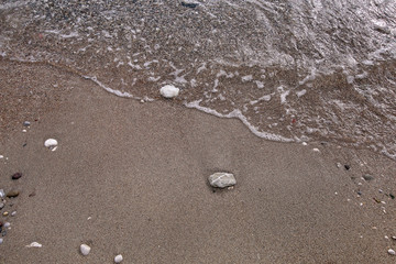 Exotic sandy beach, tropical blue mediterranean sea with waves and sea foam. Beautiful natural environment, panorama, landscape. Idyllic seaside resort in summer season, paradise and amazing scene.