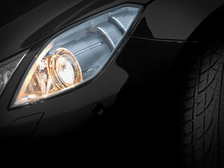 Headlights of a black car. Fragment