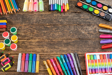 Colored pencils on the rustic table