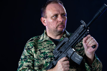 Soldier holding assault rifle