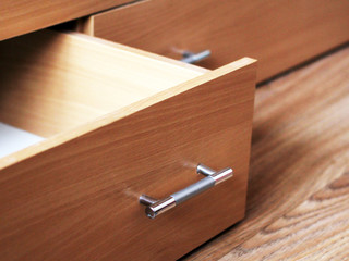 empty open drawer of nightstand so close