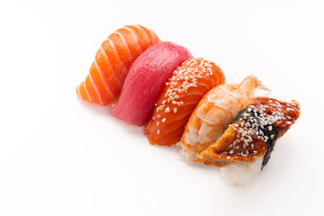 Creative layout with various sushi with eel, shrimp, salmon and tuna  on white background