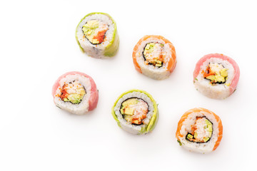 Flat lay with colorful sushi rolls with crab meat on white background