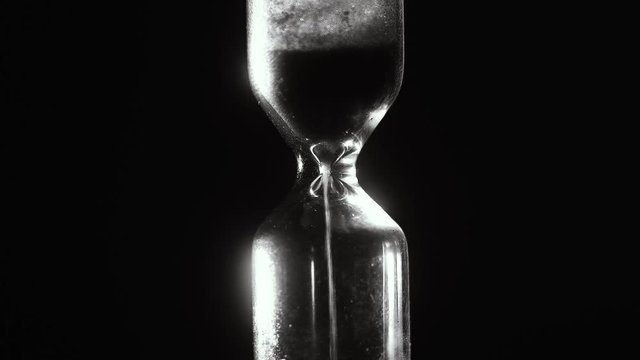 Hourglass. Black and white. Countdown. Time laps. 4k