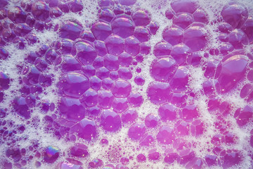 Pink soap bubbles. Abstract purple bubbles from soap for background.
