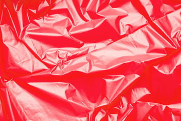 Red polyethylene texture. Background exhaust cellophane package.