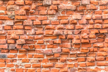Red brick wall of ruins texture facade