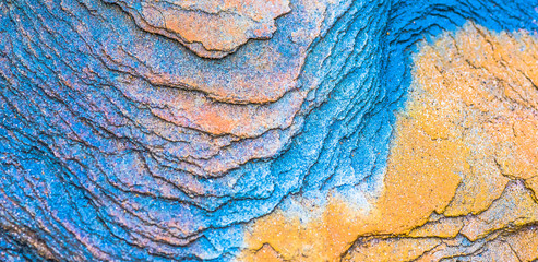 Sedimentary rocks - colourful rock layers formed through cementation and deposition - abstract...