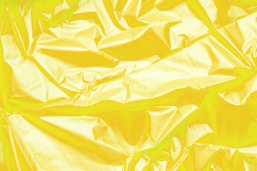 Yellow polyethylene texture. Background exhaust cellophane package.