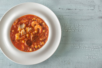 Bowl of spanish fish and chorizo soup