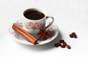 Fototapeta premium cup of coffee, grains of coffee, cinnamon, star anise