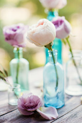 flowers in vintage bottles