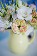 Fototapeta na wymiar Beautiful bouquet in yellow pitcher