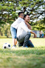 Happy children and parents playing in the park. Concept family relaxation.