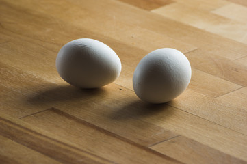 two eggs on wooden table
