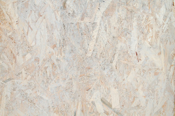 Grungy wood conglomerate background or texture