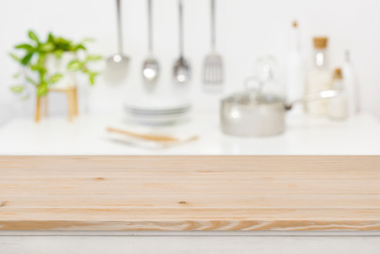 Wood table top for product display on blurred kitchen background