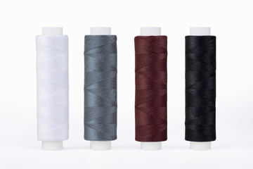 Set of sewing thread coils, miscellaneous colours, isolated on white