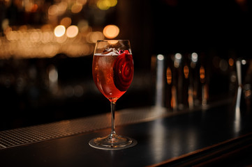 Cocktail with a decor of red vegetable slice