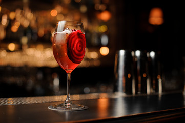 Delicious cocktail decorated with a red vegetable slice