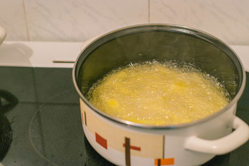Young woman cooking in the kitchen