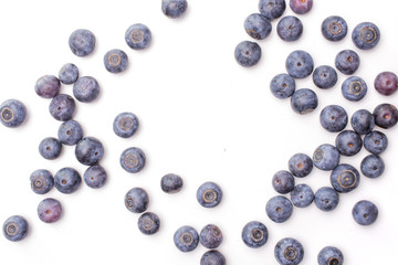 Lot of whole fresh sweet purple blueberry american flatlay isolated on white background